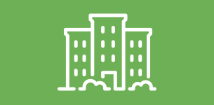 Icon in white of a building with bushes in front over a green background.