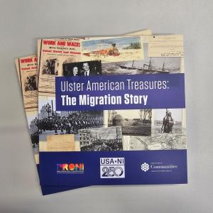 Image of two copies of a book overlapping. The books have a blue border at the bottom with three logos. Another blue text box is in the middle over a collage of archival images and reads "Ulster American Treasures: The Migration Story".