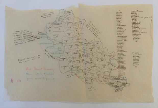 Hand drawn map of land with drawn borders between townlands and a long list of townland names on the right hand side.