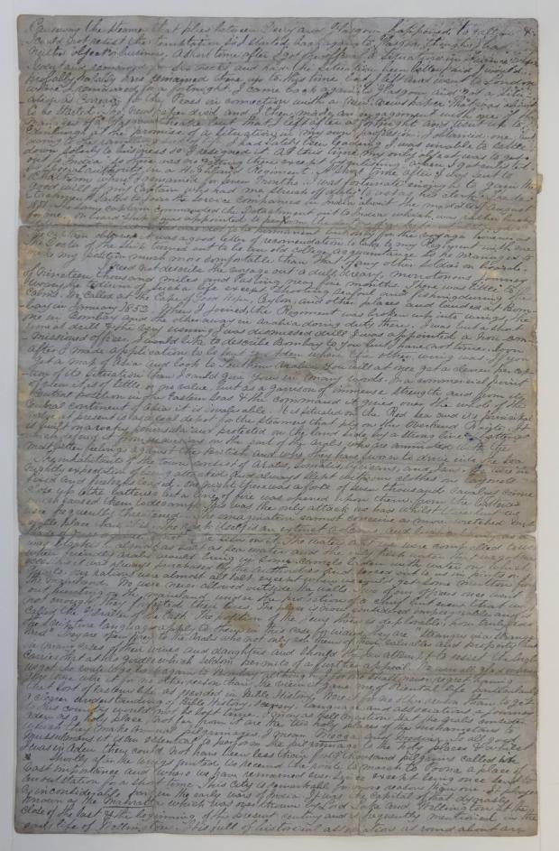 Archival document on blue paper with long text on the front.