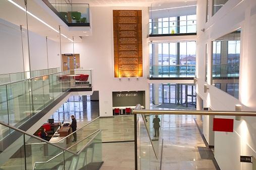 Image of a large building interior with multiple floors and landings visible.