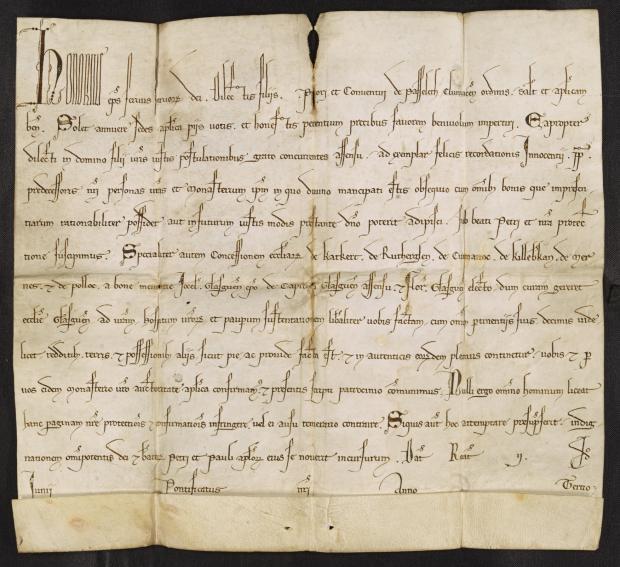 Image of a square piece of parchment with vertical and horizontal fold lines and about 12 lines of handwritten Latin text.