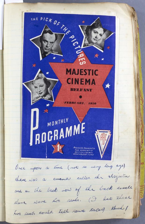 Page from a scrapbook with a bright blue programme for the Majestic Cinema in Belfast - Under the programme page, there is a handwritten caption reading "Once upon a time (not so very long ago) there was a cinema called the Majestic and in the back row of the back circle there were two seats. (I bet these two seats could tell some tales) Hush!"